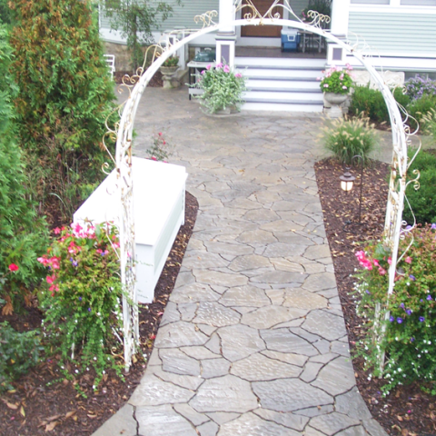 Arched Mega Arbel and Stone Front Entry Walkway