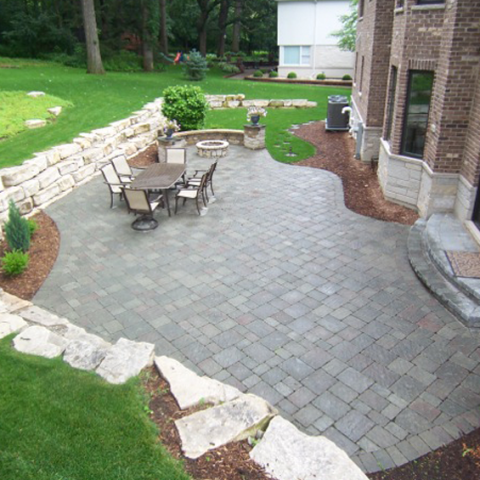 Stone Patio and Firepit with Outcropping Wall