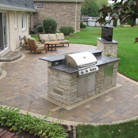 Patio pavers with TV stand and grilling station